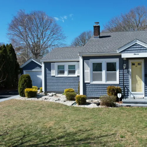 Blue shingle-sided ranch with new roof