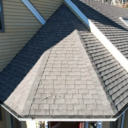 Drone view of a hip roof with new shingles