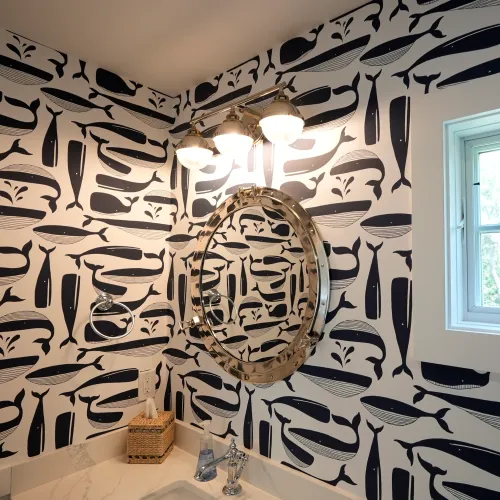 Bathroom with navy whale wallpaper